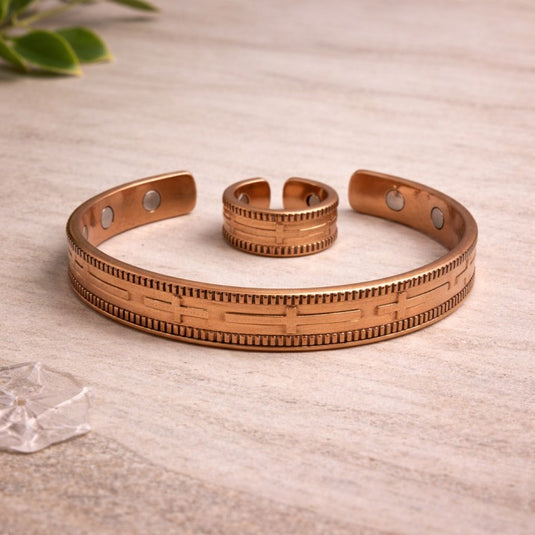 Copper bracelet on a light wooden surface with a natural background